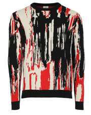 Suéter de cuello redondo para hombre de la colección Otoño-Invierno de Benito Santos, con diseño artístico abstracto en colores negro, rojo y crema.